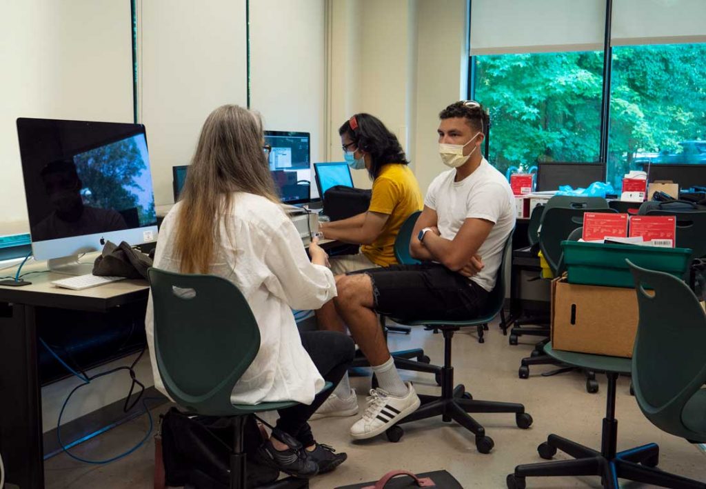 College Students working at the computer together